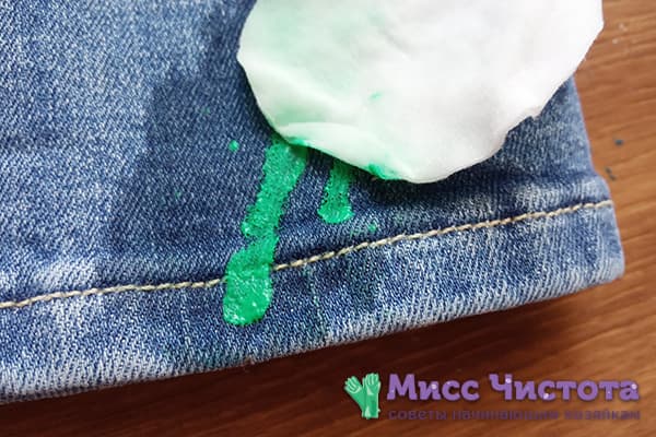 Removing paint from jeans with a solvent